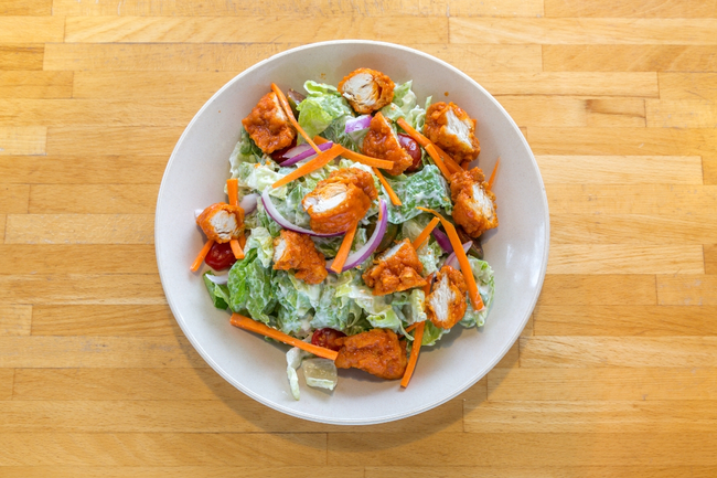 LG. Crispy Buffalo Chicken Salad:  crispy buffalo boneless chicken, romaine, carrots, red onions, cherry tomatoes, blue cheese dressing