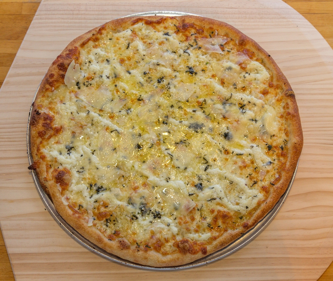 18” East Rock:  white pizza, ricotta, mozzarella, fontina, pecorino romano, minced garlic, parmigiano-reggiano, extra virgin olive oil, oregano
