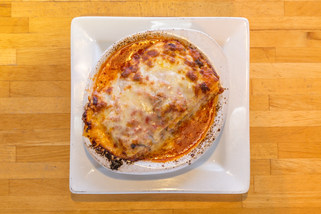 Lasagna: Four layers of fresh pasta, house-made bolognese sauce, ricotta cheese, bechamel, mozzarella
