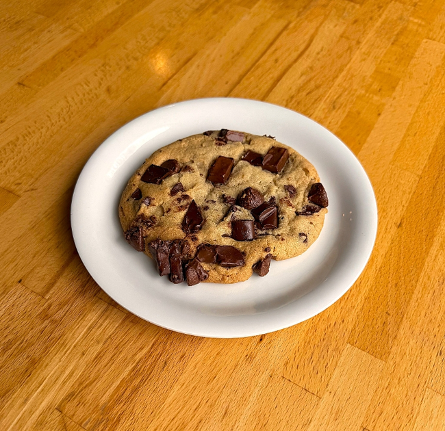 Stuff Your Face Chocolate Chip Cookie: chocolate chunk cookie dough and very generously topped with Hershey's Kisses, semi-sweet chocolate chunks and milk chocolate chunks