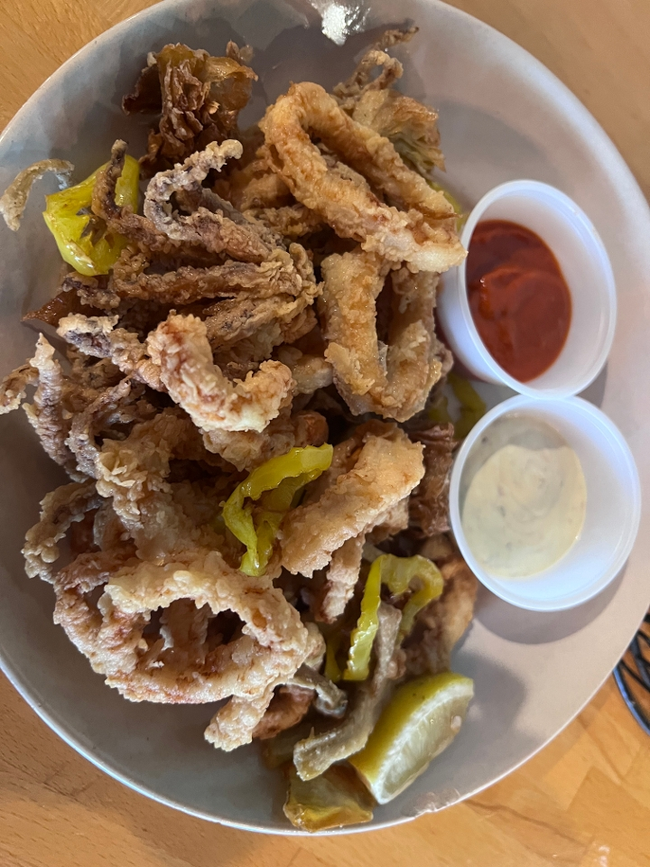 Crispy Calamari:  lightly breaded calamari, fried banana peppers & artichokes, lemon-caper aioli, spicy marinara sauce