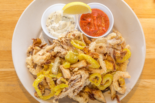 Crispy Calamari:  lightly breaded calamari, fried banana peppers & artichokes, lemon-caper aioli, spicy marinara sauce