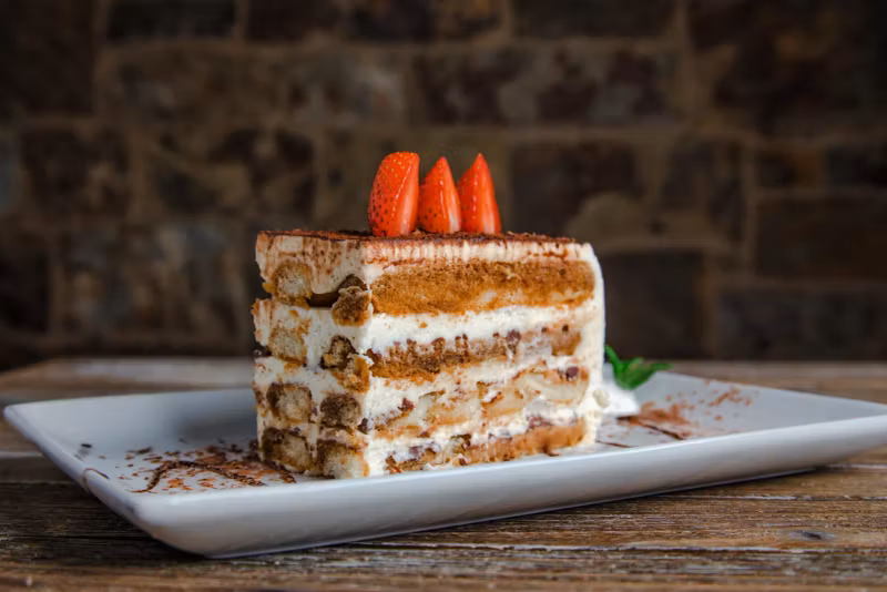 Tiramisu topped with strawberries