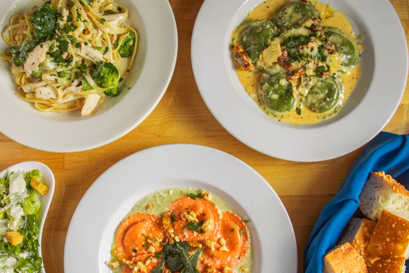 Pasta and ravioli dishes served family-style