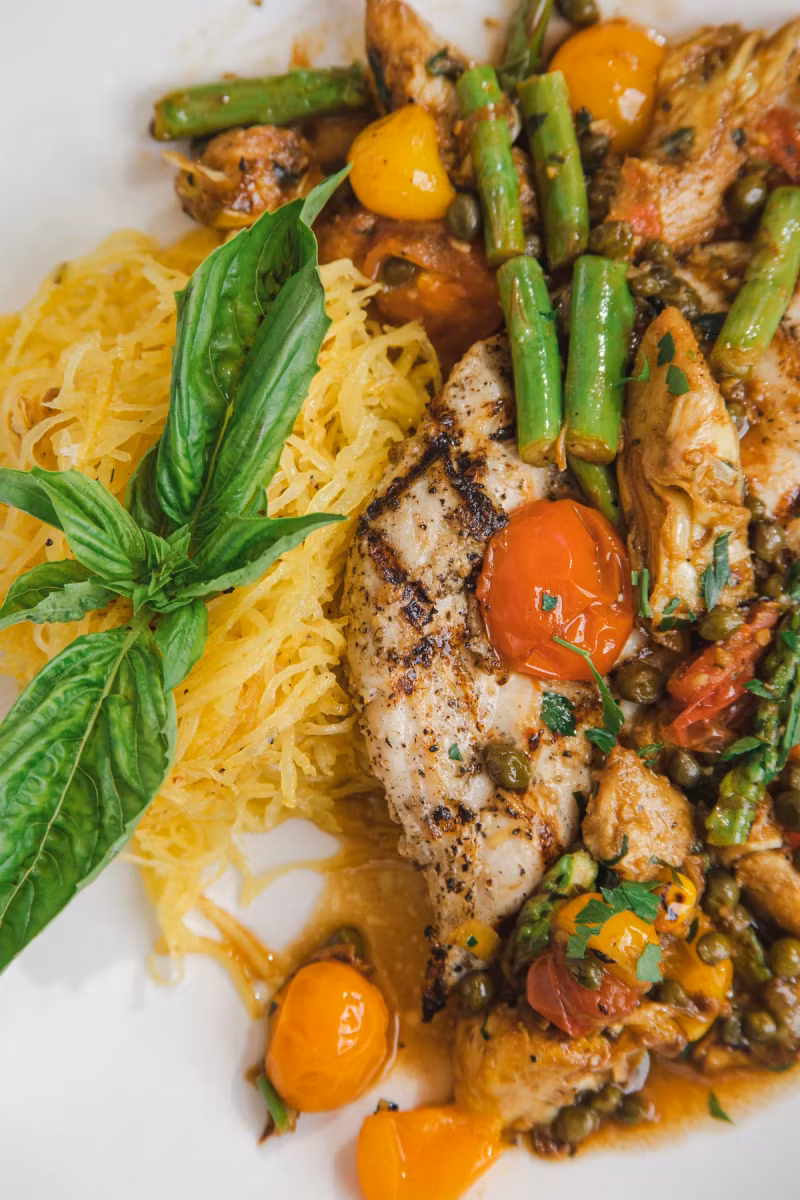 Mediterranean chicken with asparagus, cherry tomatoes and fresh basil