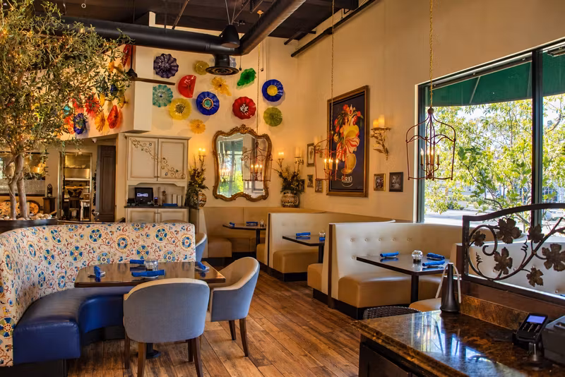 Dining room with the colorful plate wall at Tutto Fresco Rancho