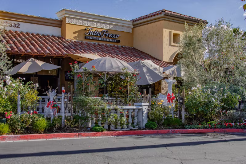Tutto Fresco Kitchen & Bar storefront and patio on El Paseo