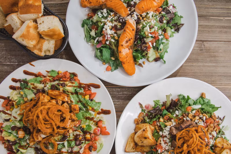 Salmon salad and seasonal salads served family-style